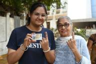 NAVI MUMBAI, INDIA - MAY 13: First time voters show their voters id card with grand mother before casting their vote for Loksabah election at Kharghar on May 13, 2024 in Navi Mumbai, India. The 96 parliamentary constituencies that polled in the phase 4 of Lok Sabha Elections 2024 on Monday recorded a voter turnout of about 63 per cent, the Election Commission of India said.(Photo by Bachchan Kumar/Hindustan Times