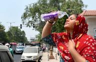 NEW DELHI, INDIA - MAY 19: A young girl washes her face as increasing temperature during hot weather, on May 18, 2024 in New Delhi, India. It was very hot in the city on Saturday. The maximum temperature was around 46 degrees Celsius and the minimum temperature was around 32 degrees Celsius. (Photo by Arvind Yadav/Hindustan Times 