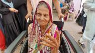 THANE, INDIA - MAY 20: Fatima Rampure, a 91-year-old senior citizen, is seen coming to vote in Rabodi on May 20, 2024 in Thane, India. According to the Election Commission of India, 57.57 per cent turnout was recorded in 49 seats in the fifth phase of polling on May 20. (Photo by Praful Gangurde/Hindustan Times