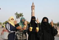 LUCKNOW, INDIA - MAY 20: Burqa-clad voters have an ice ball after casting their votes at Picture Gallery polling station during the fifth phase of Lok Sabha Election on May 20, 2024 in Lucknow, India. According to the Election Commission of India, 57.57 per cent turnout was recorded in 49 seats in the fifth phase of polling on May 20. (Photo by Deepak Gupta/Hindustan Times