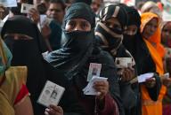 LUCKNOW, INDIA - MAY 20: Burqa-clad voters show their inked fingers after casting their at Hussainabad polling station during the fifth phase of Lok Sabha Election on May 20, 2024 in Lucknow, India. According to the Election Commission of India, 57.57 per cent turnout was recorded in 49 seats in the fifth phase of polling on May 20. (Photo by Mushtaq Ali/Hindustan Times