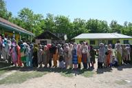 BANDIPORA, INDIA - MAY 20: People stand in queue to cast their votes outside a polling booth during the fifth phase of the Lok Sabha elections in Sumbal area of Bandipora district, north of Srinagar,on 20 May 2024.(Photo By Waseem Andrabi/Hindustan Times