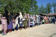 BANDIPORA, INDIA - MAY 20: People stand in queue to cast their votes outside a polling booth during the fifth phase Lok Sabha elections in Shadipora, Sumbal area on May 20, 2024 in Bandipora, India. (Photo By Waseem Andrabi/Hindustan Times