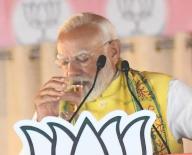 MOTIHARI, INDIA - MAY 21: Prime Minister Narendra Modi quenching his thirst during election meeting for Lok Sabha polls on May 21, 2024 in Motihari, India. (Photo by Santosh Kumar/Hindustan Times