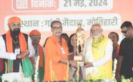 MOTIHARI, INDIA - MAY 21: BJP candidate Radha Mohan Singh presenting a memento to Prime Minister Narendra Modi during an election public meeting for Lok Sabha polls on May 21, 2024 in Motihari, India. (Photo by Santosh Kumar/Hindustan Times