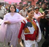 PATNA, INDIA - JUNE 1: Former Bihar Chief Minister Rabri Devi with RJD candidate Rohini Acharya coming out after cast vote during seventh and last phase of Lok Sabha election at Bihar Veterinary College on June 1, 2024 in Patna, India. (Photo by Santosh Kumar\/Hindustan Times