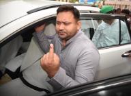 PATNA, INDIA - JUNE 1: RJD leader Tejashwi Yadav showing finger ink mark after cast vote during seventh and last phase of Lok Sabha election at Bihar Veterinary College on June 1, 2024 in Patna, India. (Photo by Santosh Kumar\/Hindustan Times