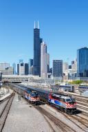 Skyline with METRA trains regional train railway local traffic at Union Station in Chicago, USA, North