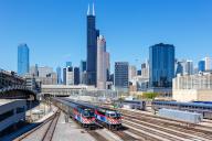 Skyline with METRA trains regional train railway local traffic at Union Station in Chicago, USA, North