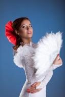 Young woman dance in white oriental flamenco