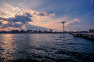 Sun sets on a warm summer day in Coney Island, Brooklyn, NY, USA, USA, North