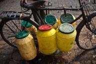 Plastic barrels, water, draw, public water pump, Jharkhand, India