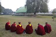Tibetan monks, reciting sacred texts, tablet, smartphone, buddhism, stupa, Vaishali, Bihar, India