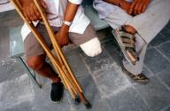 Leg amputee, crutches, relative, men, India