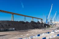 View of unloaded coal in the harbour of Tarragona, Spain