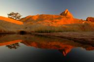 Spitzkoppe in the evening sun reflected in the