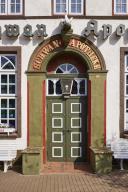 Entrance door of the Swan pharmacy in the city centre of Husum, district of Nordfriesland, Schleswig-Holstein, Germany