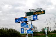 Signpost on the International Dollard Route cycle path in the border area at the Nieuwe Statenzijl lock, municipality of Oldambt, Dollart, Dollard, province of Groningen, Netherlands, German side Rheiderland, East Friesland, Lower Saxony, Germany,