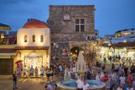 St Pauls Gate, Hippocrates Square, Lively square at night with a fountain and surrounding shops, Night shot, Rhodes Old Town, Rhodes, Dodecanese, Greek Islands, Greece