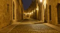 Knights Street, An empty, stone street at night, flanked by historic buildings, night shot, Rhodes Old Town, Rhodes, Dodecanese, Greek Islands, Greece