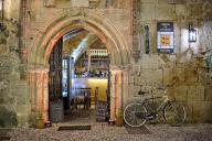 Rustic scene with a bicycle in front of a wine bar at night, night shot, Rhodes Old Town, Rhodes, Dodecanese, Greek Islands, Greece