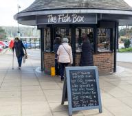 Customers buying fresh fish from The Fish Box fishmongers, Woodbridge, Suffolk, England