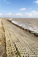 Coastal defences North Sea coast at East Lane, Bawdsey, Suffolk, England, UK sheet piling inclined stone surface drainage