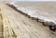 Coastal defences North Sea coast at East Lane, Bawdsey, Suffolk, England, UK sheet piling inclined stone surface drainage
