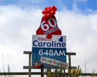 Radio Caroline pirate radio station 60 years old happy birthday balloons and poster, Suffolk, England