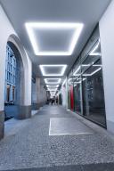 An illuminated passageway with modern architecture and a cool atmosphere at dusk, Berlin, Germany