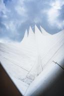 View of a futuristic-looking white tent roof against the sky, Tempodrom, Berlin, Germany