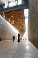 Wide museum hall with concrete walls, wooden ceiling and monumental sculpture, König Galerie, Berlin, Germany