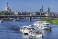 Every year on 1 May, the historic passenger steamers (PD) and the two saloon ships of the White Fleet form a decorated parade with live music on the ships. The banks and bridges of the Elbe are lined with thousands of spectators, Dresden, Saxony,