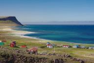 Abandoned houses on a wide bay with sandy beaches, Latrabjarg, Westfjords, Iceland