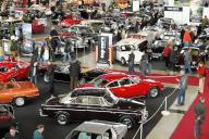 Vintage cars are presented at a car show, surrounded by visitors, Stuttgart Messe, Stuttgart, Baden-Württemberg, Germany