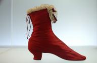 Red silk boot from around 1870 Fashion Department at the Victoria & Albert Museum, 1-5 Exhibition Rd, London, England, Great