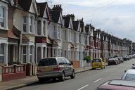 Typical English terraced houses with telephone lines, Valnay Street, Tooting Broadway, London, England, Great