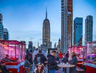 Open-air terrace on the 20th floor: 230 Fifth Rooftop Bar NYC in front of the Empire State Building, New York