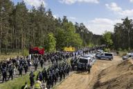 Participants and police on the L23 road at the Wasser. Forest. Justice against the expansion of the Tesla Gigafactory in Grünheide near Berlin, 11.05