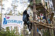 A person climbs up ropes to one of the tree houses in the occupied section of the Tesla Stop forest. The occupation of the forest is intended to demonstrate against the imminent clearing for the planned expansion of the Tesla Gigafactory in Gr