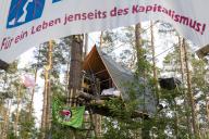 Tree house with and banner For a life beyond capitalism! in the occupied forest section Tesla Stop . The occupation of the forest is intended to demonstrate against the imminent clearing for the planned expansion of the Tesla Gigafactory in Gr