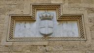 Weathered stone relief of a crowned coat of arms in a wall niche, Grand Masters Palace, Knights Town, Rhodes Town, Rhodes, Dodecanese, Greek Islands, Greece