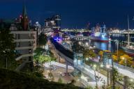 Night view with ships, Elbe Philharmonic Hall and S-Bahn station, Hamburg, Germany