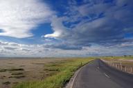 Road leads through tidal landscapes at low tide, Lindisfarne, Northumberlands, England, Great