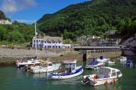 Small harbour, fishing boats and a small village in a hilly landscape, North Devon. Great