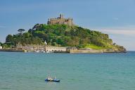 Small boat in front of an island, garden and small harbour, Saint Michaels Mount, Penzance, Cornwall, Great