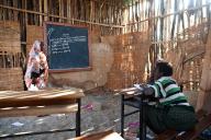 Muslim female teacher teaching mathematics, school in a remote village inhabited by the Afar tribespeople, Ethiopia