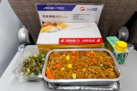 Aeroplane meal in the COMAC ARJ21-700 aircraft of OTT Airlines with the registration number B-653S at Pudong Airport (PVG) in Shanghai, China