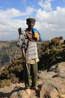 In the highlands of Abyssinia, in the Semien Mountains, landscape in the Semien Mountains National Park, guard, accompanying person, Ethiopia