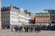 Tourists walk across the cathedral square in the Latvian capital Riga, Latvia